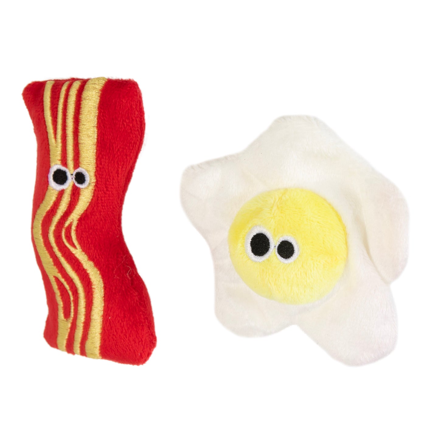 The Mad Cat Brunch Buddies Bacon N Eggs Catnip & Silvervine Cat Toy features a cartoon-eyed bacon strip and sunny-side-up egg, perfect as whimsical cat toys. The bacon is red with yellow stripes, the egg white with a yellow center, all infused with catnip for feline fun!.
