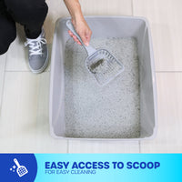 A person wearing gray sneakers cleans a large, gray Petmate Basic Litter Box made from EcoTech™ resin using a scooper. The open-top design offers easy access. A blue banner states: Easy access to scoop for easy cleaning.