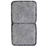 The Petmate Fresh Flow Replacement Charcoal Filter by Petmate is a rectangular, gray, felt-like filter with two sections and black, stitched edges featuring a grid pattern. Its soft, fibrous texture resembles charcoal filters and is ideal as replacement filters for pet water fountains.