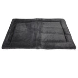 The Petmate Kennel Mat by Petmate is a soft, dark gray rectangular bed with a plush mattress and slightly raised border. Its smooth texture offers a cozy space for pets, while the non-skid bottom ensures stability against a white background.