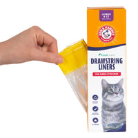 A hand pulls a yellow drawstring from an Arm & Hammer Drawstring Pan Liners box for jumbo cat litter pans, featuring a gray cat image and labeled Jumbo 8 CT, emphasizing the fresh scent of baking soda.