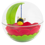 The Mad Cat Buzzy Ball Cat Toy encases a vibrant scene inside a clear plastic sphere, featuring a green leaf, red flower, and black-and-yellow bee with transparent wings. The bee hangs from a blue string above the flower for your cats enjoyment.