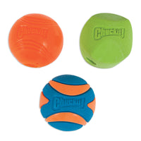 The Chuckit! Fetch Medley 2 features three colorful dog toys: a smooth orange ball, a green hexagonal ball, and a textured blue and orange ball. Made from natural rubber, each bears the Chuckit brand name.