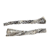 Two Wild Eats Cod Skin Twist Dog Treats, rich in Omega-3 Fatty Acids, are displayed on a white background. The textured twists feature natural scale-like patterns with browns, grays, and hints of white.