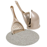 The Petmate Scoop N Hide Cat Litter Scoop, by Petmate, is a beige scoop and holder set on a circular textured mat. The deep bucket scoop with sifting slots fits into a curved-back holder, offering easy cleaning and organization.