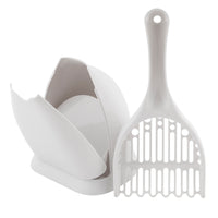 The Petmate Scoop N Hide Cat Litter Scoop, by Petmate, offers a white design with a long-handled, slotted scoop for easy sifting and a custom-designed holder for convenient storage. Made from durable plastic, both pieces ensure long-lasting use.