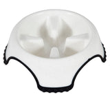 The JW Skid Stop Slow Feed Bowl from Jw is perfect for fast-eating dogs. It features a white bowl with raised dividers to pace meals, rugged black outer edges with textured grips, and a skid-stop base for stability.