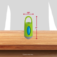 A compact green Arm & Hammer Dispenser with a top handle sits on a wooden surface. At 1.8 inches wide and 4 inches high, its ideal for storing dog waste bags with odor control. The text Colors may vary appears at the bottom.