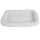 The SnooZZy Faux Sheepskin Bolster Kennel Mat by Snoozzy is a rectangular white fleece pet bed with a cushioned border, perfect for crate training. Its ideal for small pets, featuring a soft, textured surface and is machine washable for easy care.