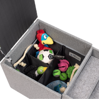 The PetFusion Multi-Purpose Pet Stairs, by Pet Fusion, serve as a premium gray storage ottoman filled with colorful pet toys like a plush parrot and soccer ball. Its thoughtfully sectioned interior offers an organized, multi-functional solution for play and tidy living.